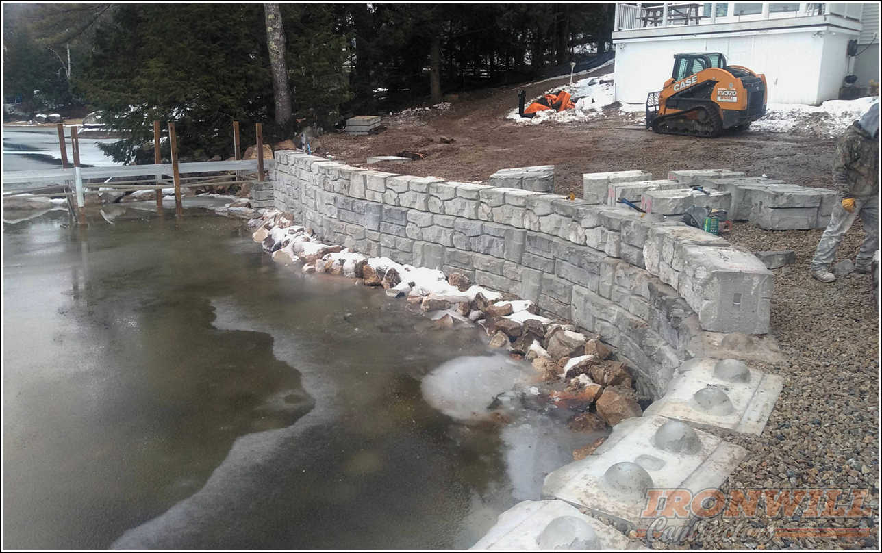 Ironwill Contractors, LLC - lakefront stone retaining wall job Ironwill Contractors, LLC - lakefront stone retaining wall job