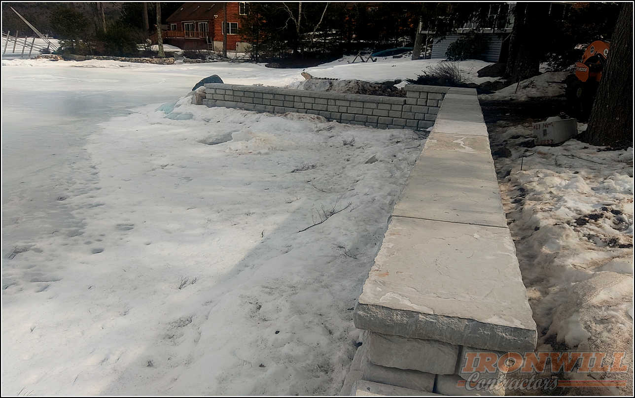 Ironwill Contractors, LLC - lakefront stone retaining wall job Ironwill Contractors, LLC - lakefront stone retaining wall job